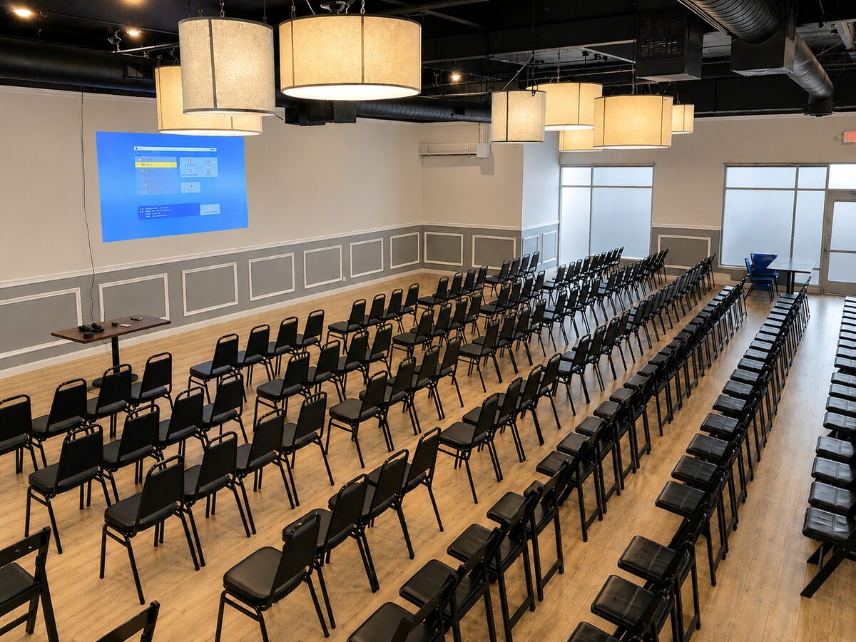 Elijah's private banquet room in theater seating with a mounted projector screen