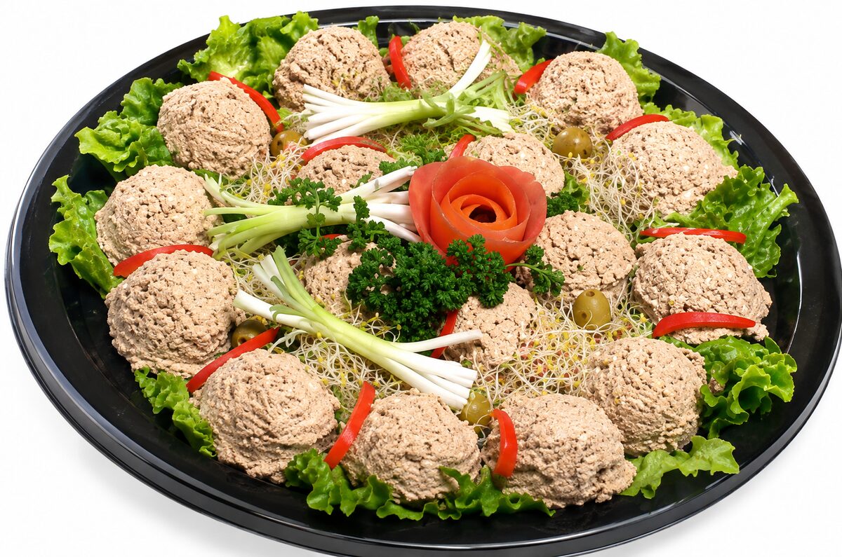 Chopped liver platter garnished with greens and a tomato rose