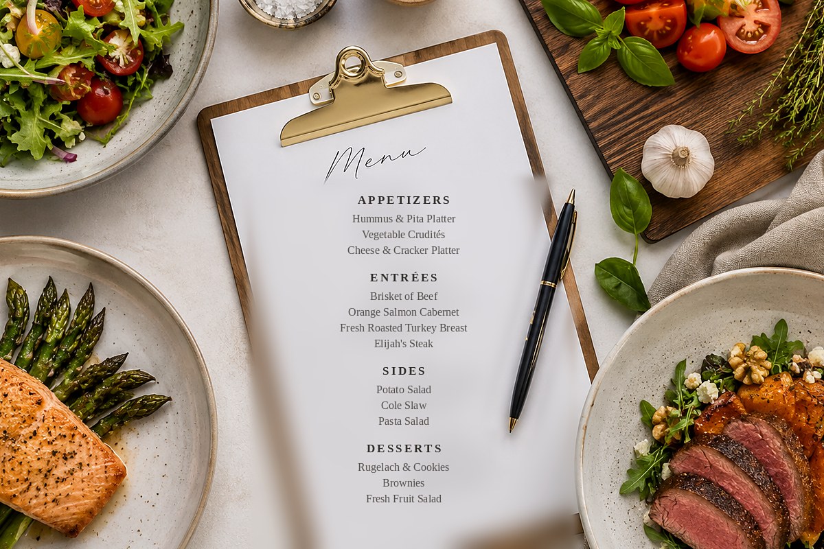 Elijah's catering menu on a clipboard beside plated dishes
