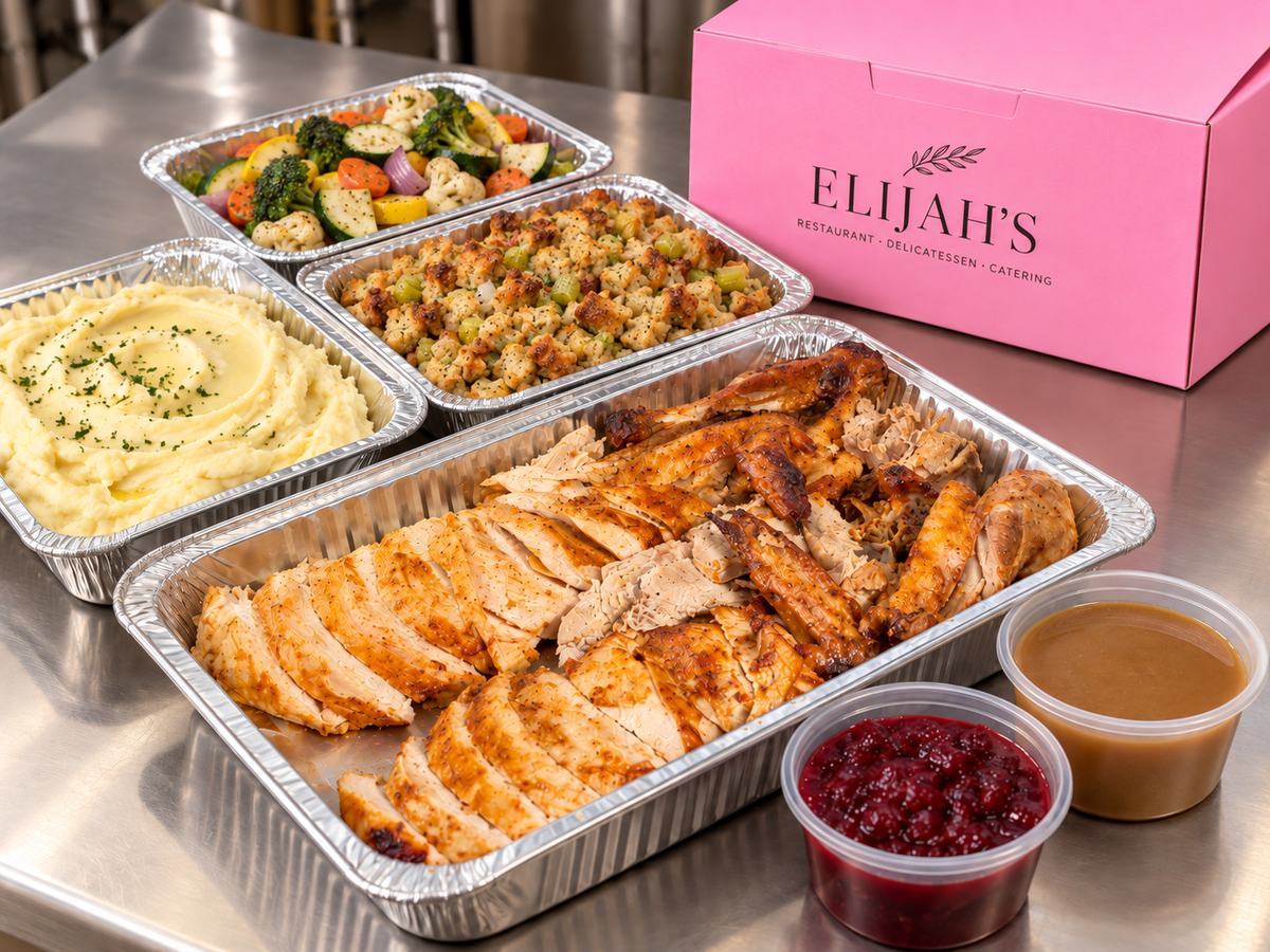 Carved roasted turkey holiday dinner to go in foil pans with sides, gravy and cranberry sauce, ready to serve, San Diego